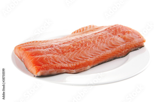 raw salmon fillet on white plate