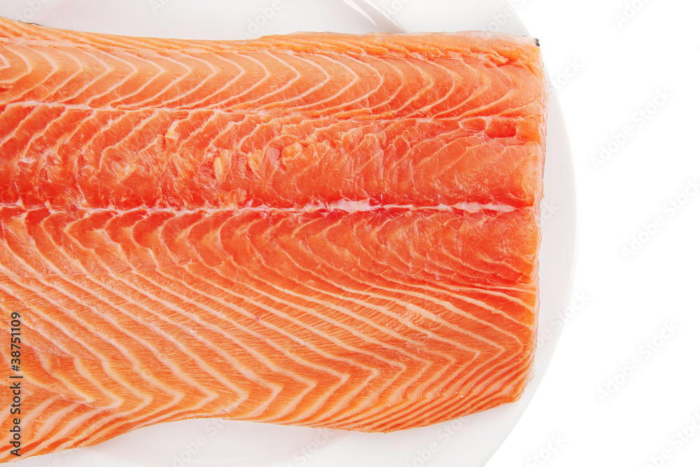 raw salmon fillet on white plate raw salmon fillet on white plate