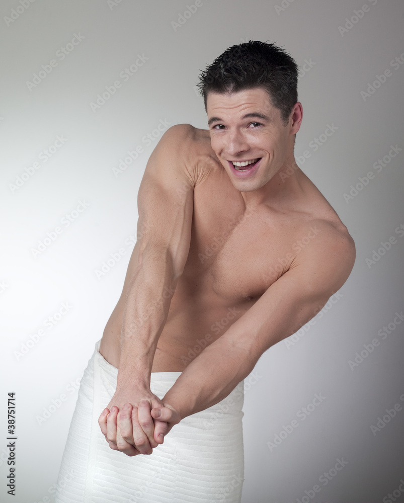 smiling man showing his muscles smiling man showing his muscles