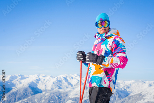 Young man with skis and a ski wear