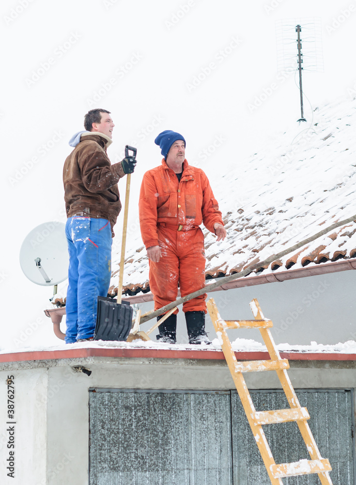 Men cleaning snow