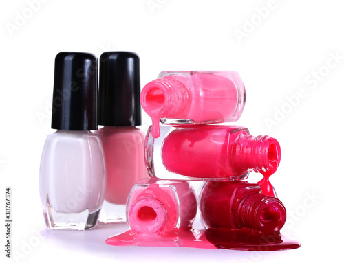 open bottles with bright nail polish isolated on white