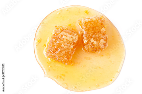 Fresh honey and honeycomb slices, studio shot, view from above