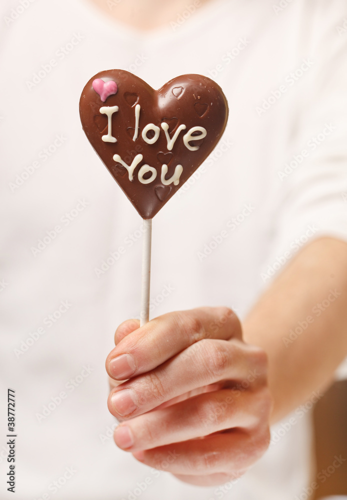 man with chocolate heart in the hands man with chocolate heart in the hands