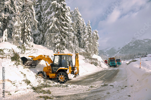 clearing roads of snow and fallen tree