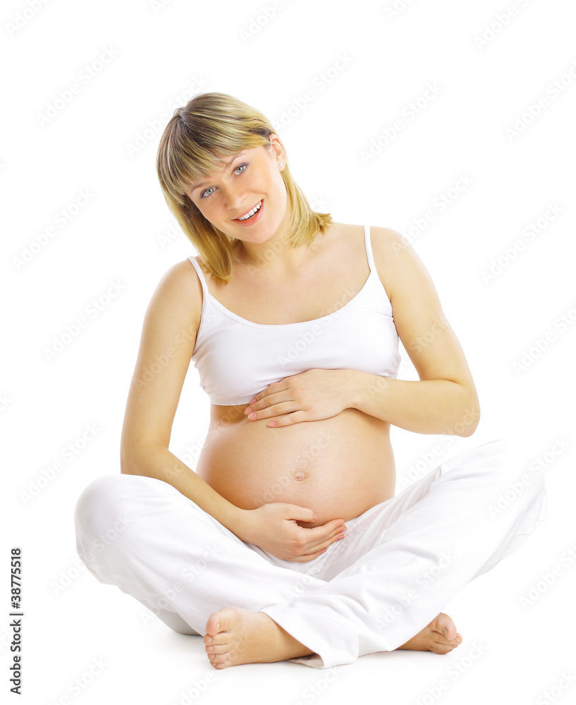 Pregnant woman sitting and practicing yoga isolated on white Pregnant woman sitting and practicing yoga isolated on white