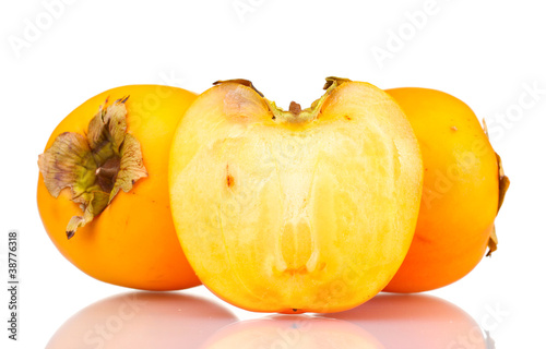 Two and half appetizing persimmons isolated on white