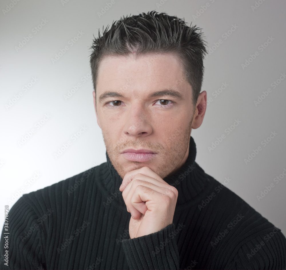 young handsome man thinking