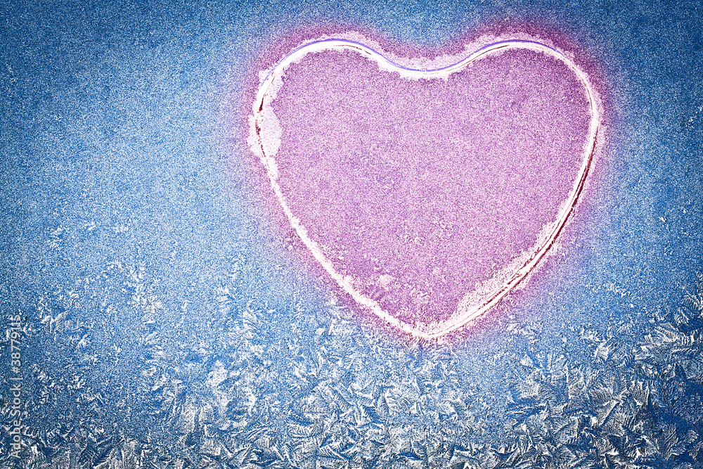 Snowflakes at a window in the form of heart Snowflakes at a window in the form of heart