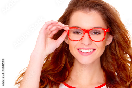 Portraif of young woman wearing glasses on white