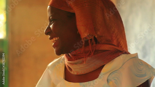Close up of a teacher in a full classroom in Kenya.