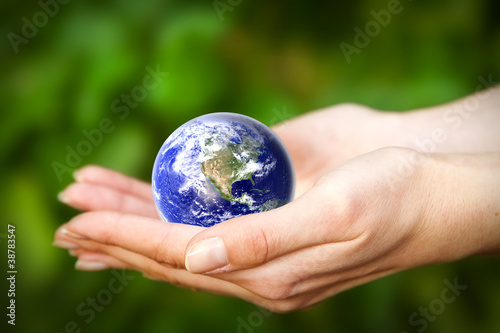 Earth in hands. Glass World