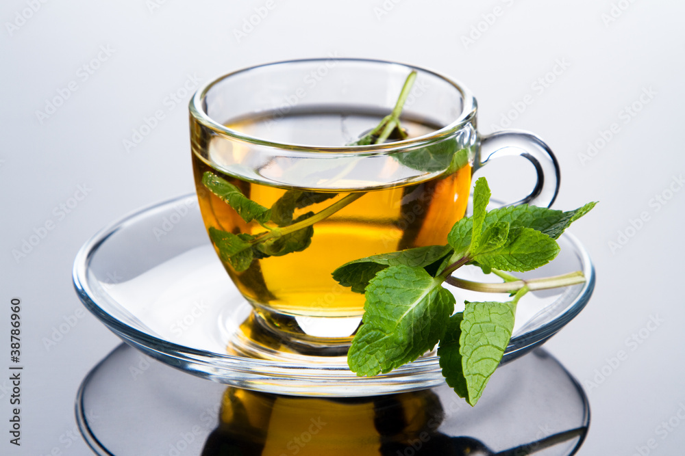 Tea cup with fresh mint leaves