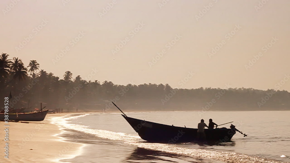 Fishing boat arriving at a magnificent Goan beach