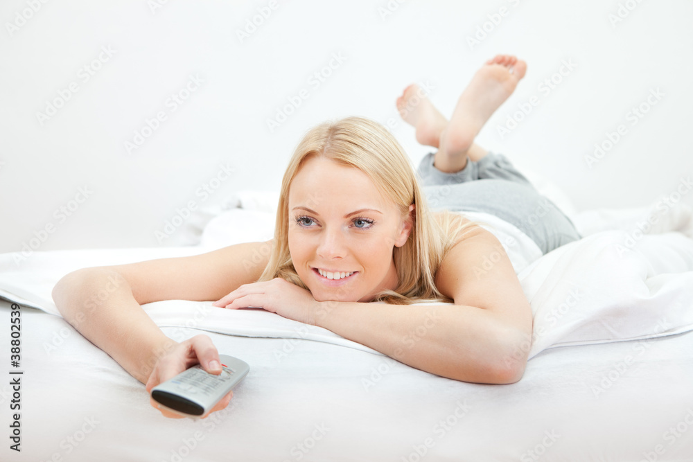 Young beautiful woman lying in bed Young beautiful woman lying in bed