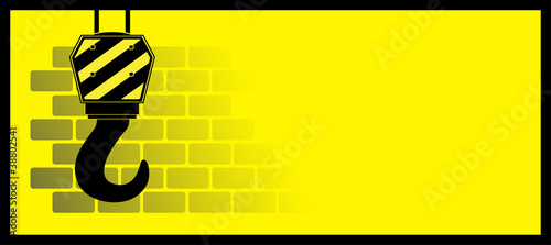 yellow construction background with bricks and hook