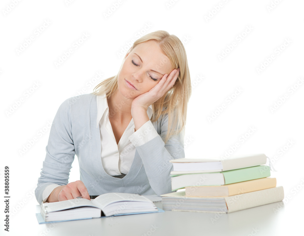 Beautiful student girl tired from doing homework Beautiful student girl tired from doing homework