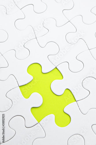 Jigsaw puzzle with green piece missed