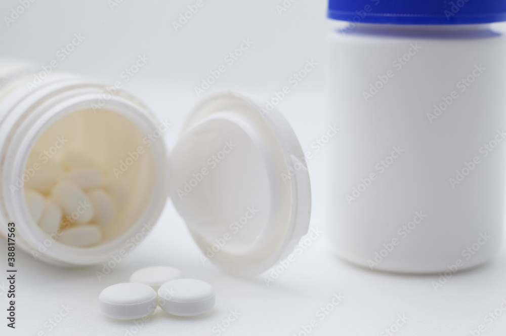 Pills and pill bottle. Pills and pill bottle.