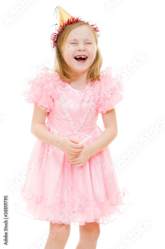 A girl in a pink dress and hat laughing on white background.