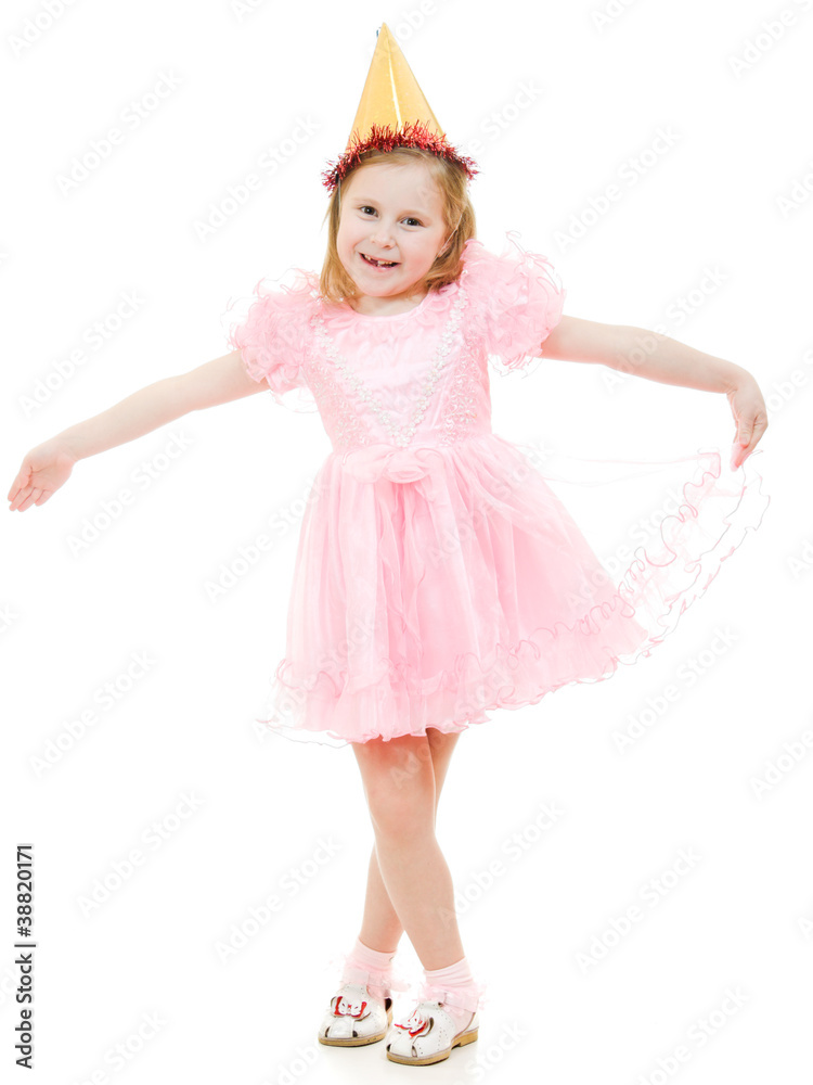 A girl in a pink dress and hat dances on a white background.