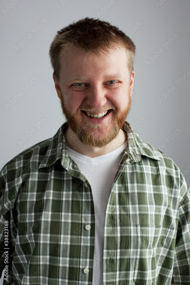Fototapeta premium Young man in a plaid shirt