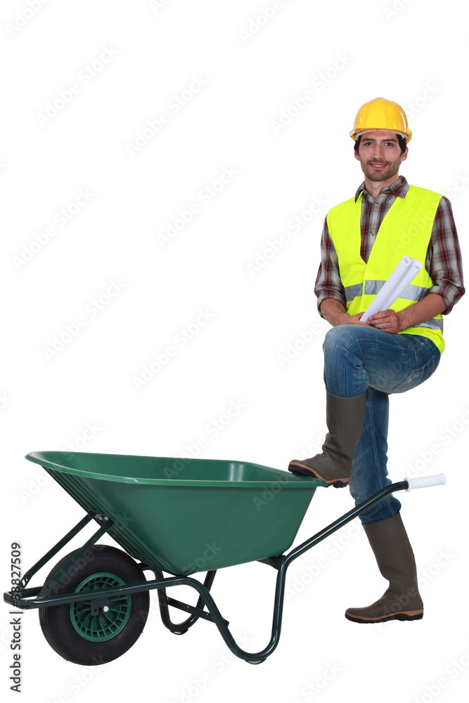 Man stood with empty wheelbarrow Man stood with empty wheelbarrow