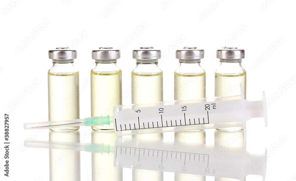 Syringe and medical ampoules isolated on white