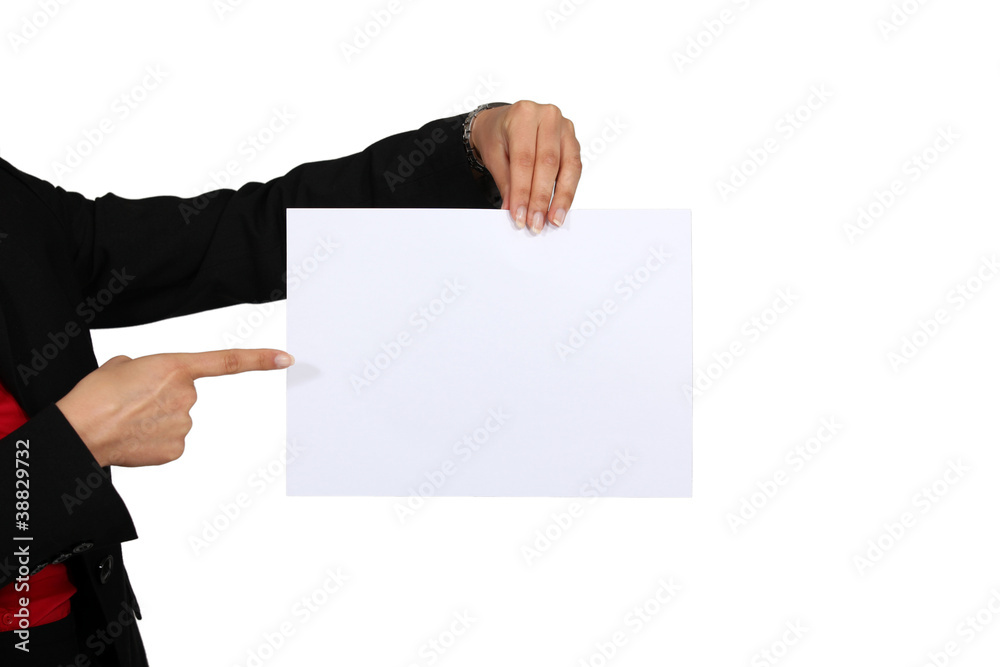 hand pointing at white sheet of paper hand pointing at white sheet of paper