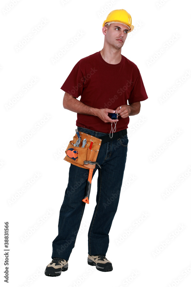 A very annoyed tradesman holding a chalk line A very annoyed tradesman holding a chalk line