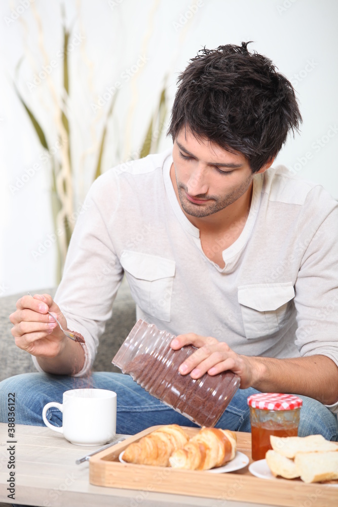 Man having a casual breakfast Man having a casual breakfast
