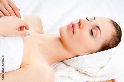 young woman lying relaxed in the spa