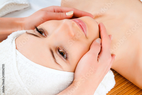 woman receiving facial massage