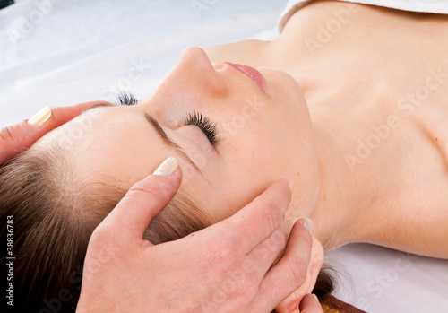 woman receiving facial massage