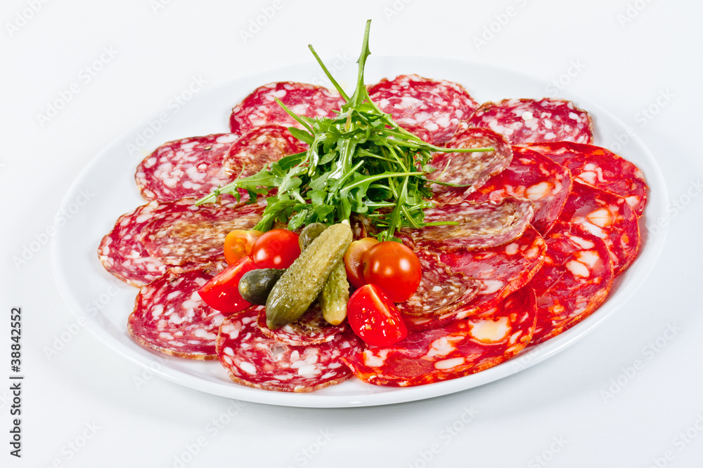 Italian sausage assorted with tomato, cucumber and ruccola Italian sausage assorted with tomato, cucumber and ruccola