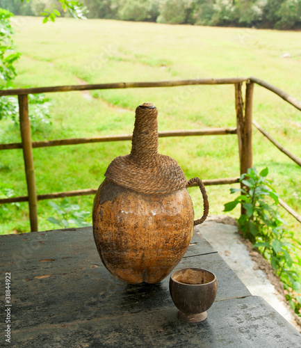 The bottle made of coconut nut wirh traditional cashew drink. Go