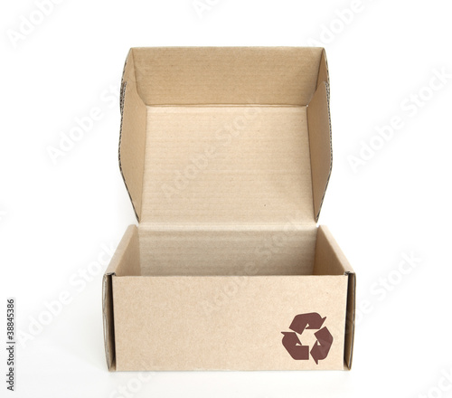 empty cardboard box with recycle logo on white background photo