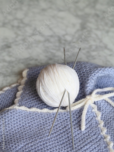 Knitting ball and knitted baby clothes