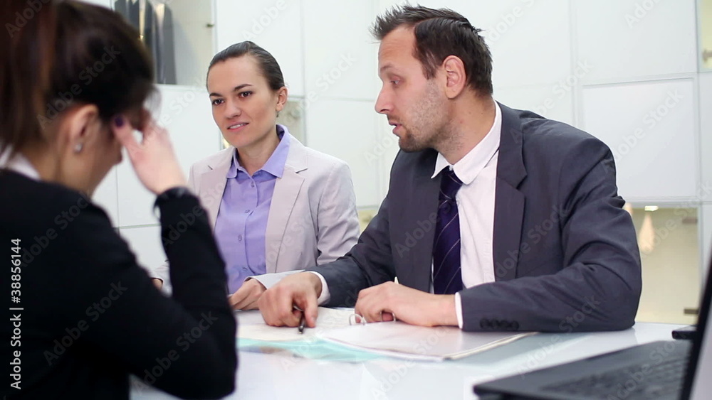 Female client in bank talking with business consultants Female client in bank talking with business consultants