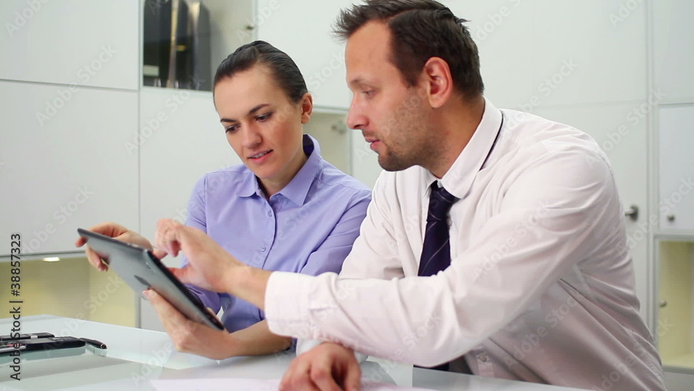 Business people working with digital tablet in office Business people working with digital tablet in office