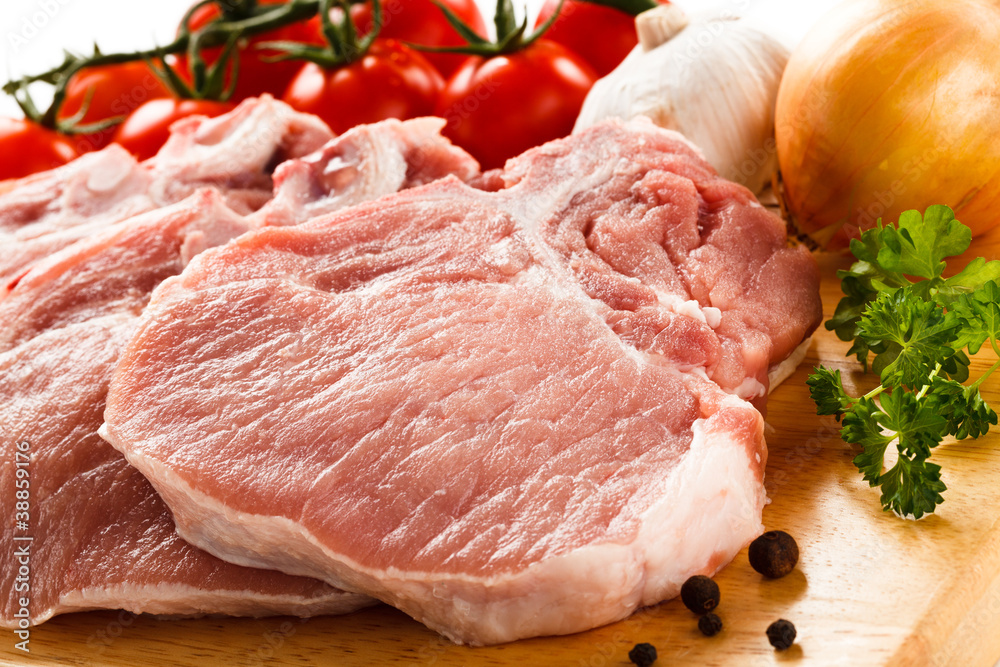 Fresh raw pork on cutting board Fresh raw pork on cutting board