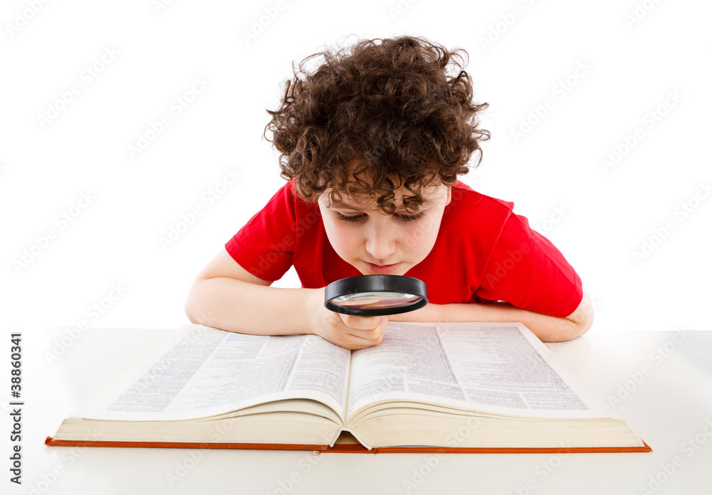 Boy looking through magnifying glass isolated on white Boy looking through magnifying glass isolated on white