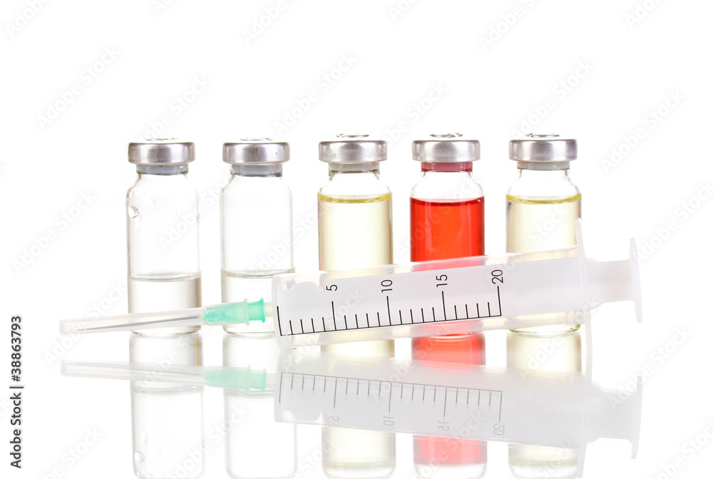 Syringe and medical ampoules isolated on white