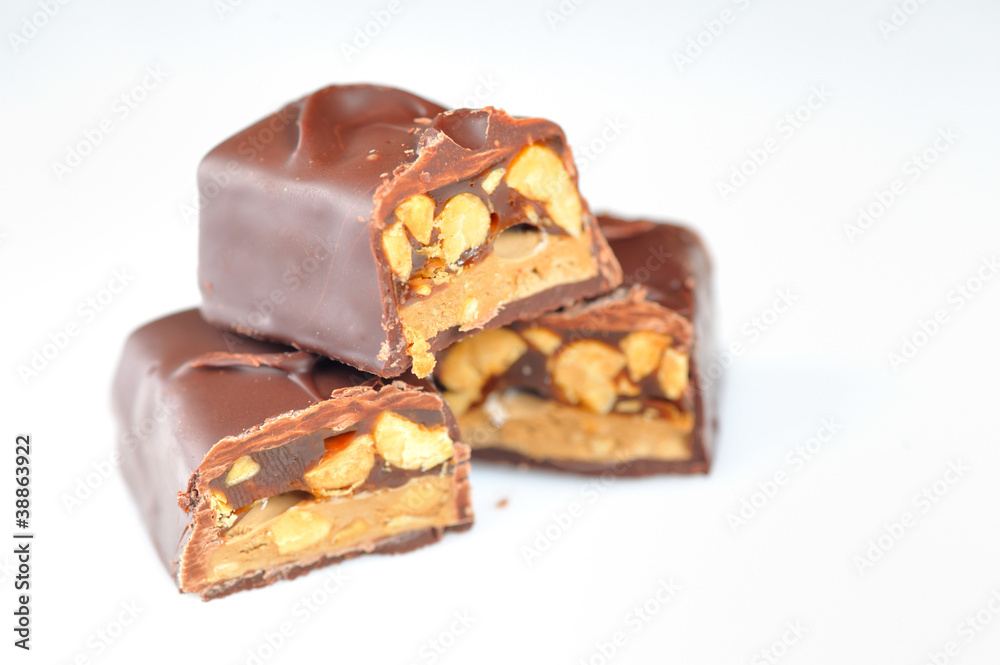 Chocolate covered bar with caramel and hazelnut Chocolate covered bar with caramel and hazelnut