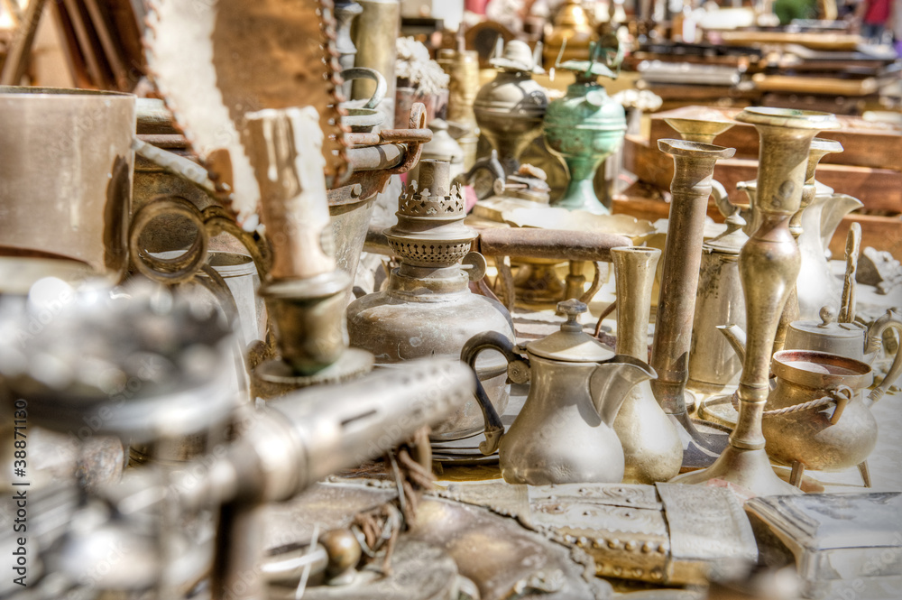 Brass antiques at a market stall. High dynamic range image. Brass antiques at a market stall. High dynamic range image.