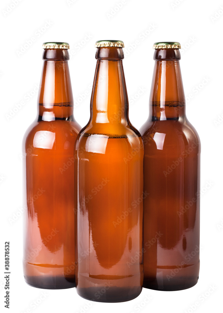 three dark beer bottles over white background three dark beer bottles over white background