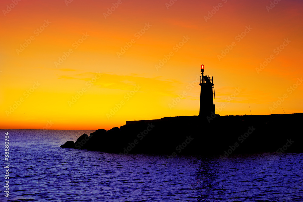 Golden sunrise sunset in sea red beacon lighthouse