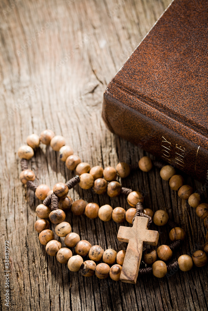wooden rosary and the Bible wooden rosary and the Bible