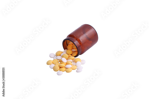 Pills spilling out of pill bottle