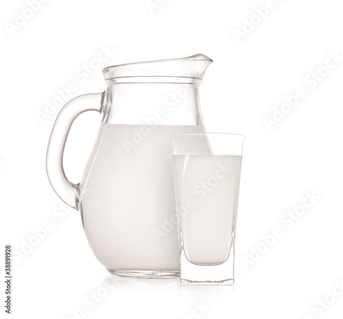 Milk jug with glass over white background